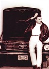 Male Model Standing with a Broken Down Car